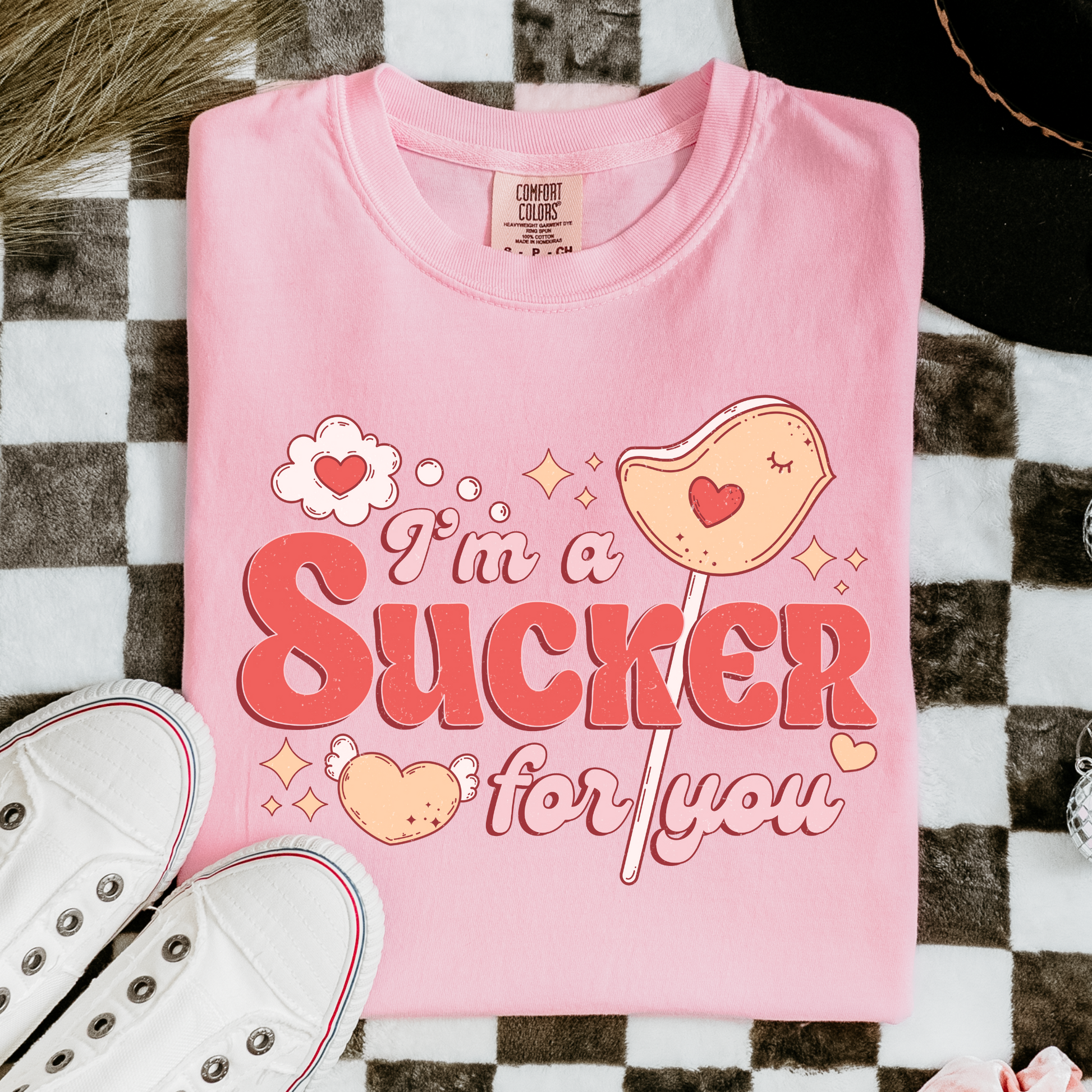 a pink shirt that says i'm a sucker for you