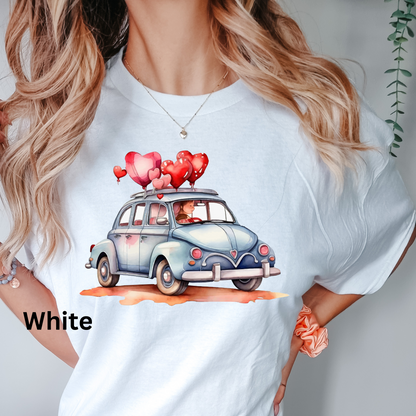 a woman wearing a t - shirt with a car with hearts on it