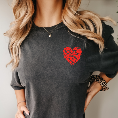 a woman wearing a black shirt with a red heart on it