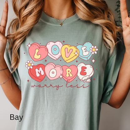 a woman wearing a t - shirt that says love more